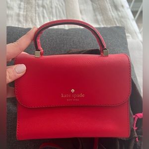 Beautiful mini Kate Spade red crossbody bag with handle for sale, gently used